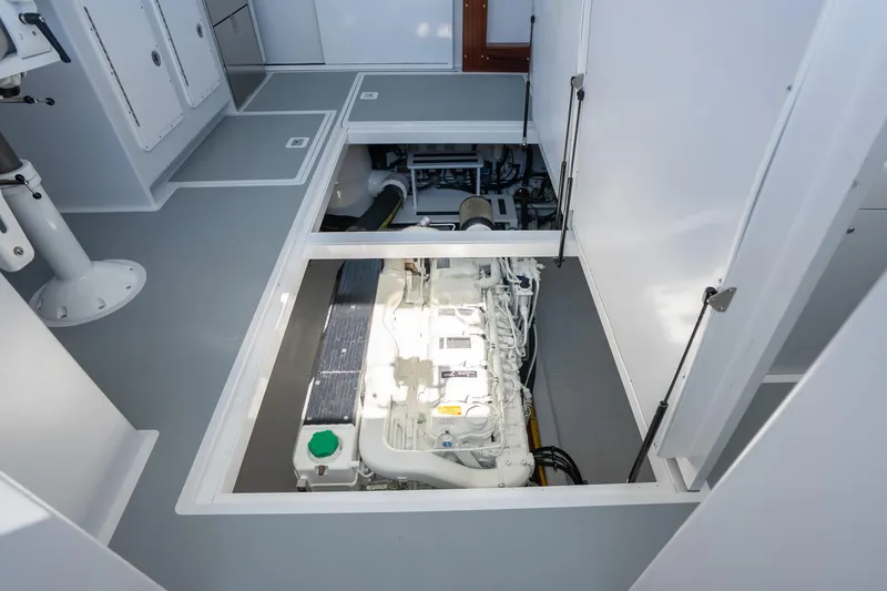Slide: The Image of Engine room of 2025 Mussel Ridge 42 boat, showcasing modern marine engine. - 50
