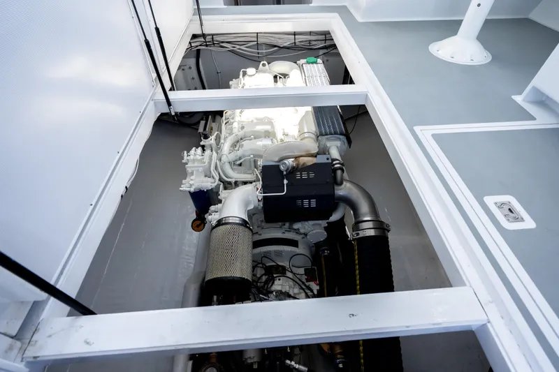 Slide: The Image of Engine compartment of 2025 Mussel Ridge 42 boat, showcasing modern marine engine design. - 51