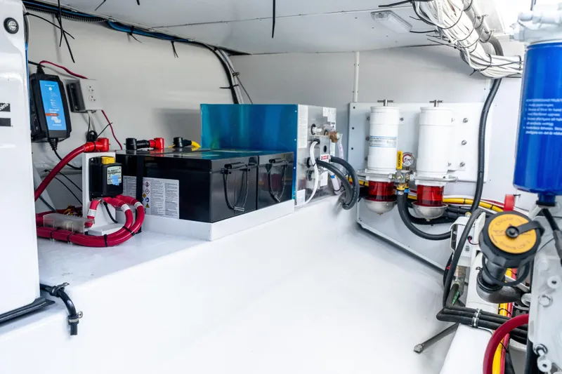 Slide: The Image of Engine room of 2025 Mussel Ridge 42 boat with batteries and filtration system. - 54