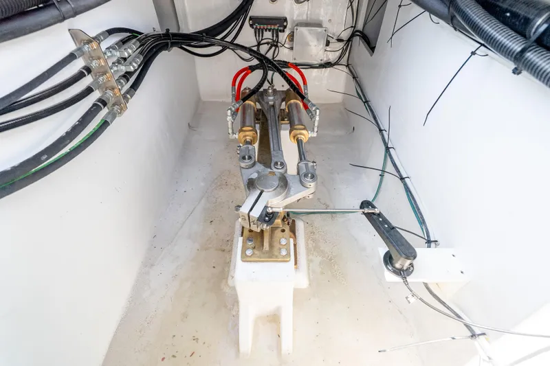 Slide: The Image of Engine compartment of 2025 Mussel Ridge 42 boat, showcasing hydraulic and electrical systems. - 56