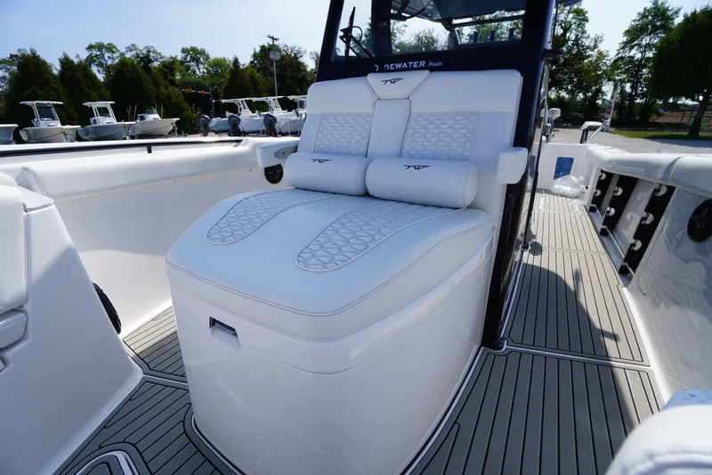 Slide: The Image of 2026 Tidewater 302 CC Adventure boat with luxurious seating and sleek design. - 13