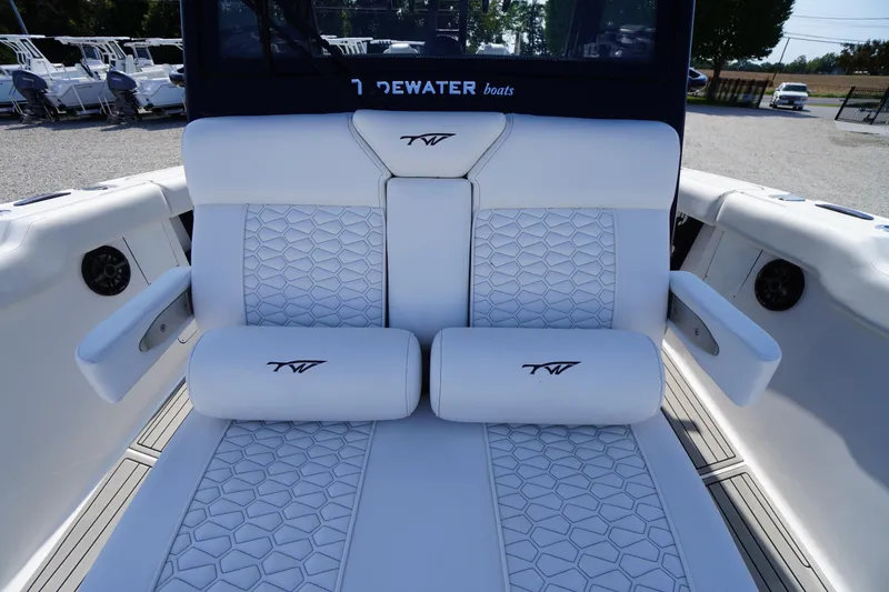 Slide: The Image of 2026 Tidewater 302 CC Adventure boat with luxurious white seating and armrests. - 14
