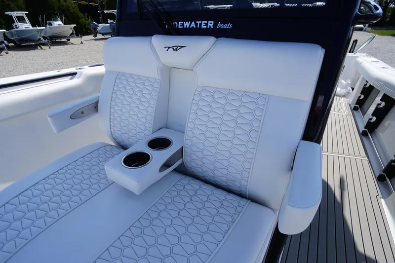 Slide: The Image of Luxurious seating on 2026 Tidewater 302 CC Adventure boat with cup holders. - 15