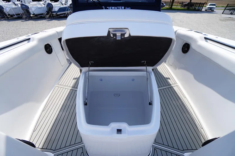 Slide: The Image of 2026 Tidewater 302 CC Adventure boat with open storage compartment on deck. - 16