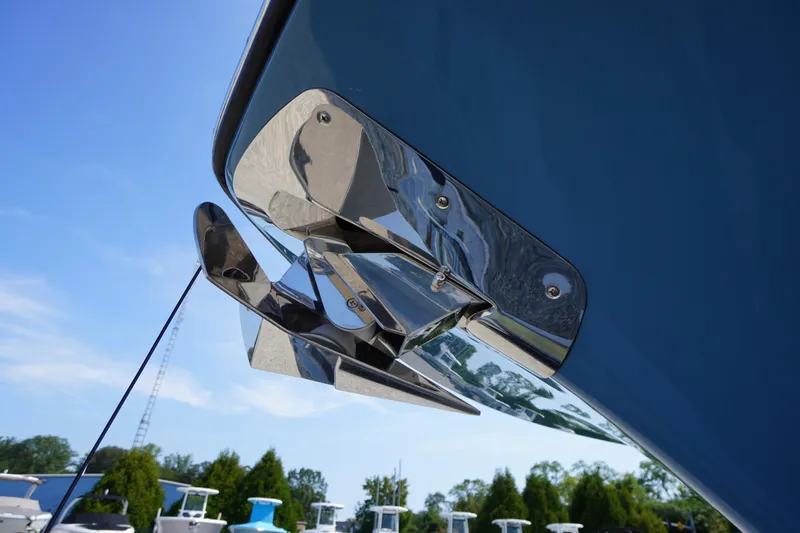 Slide: The Image of Close-up of 2026 Tidewater 302 CC Adventure boat anchor against blue sky. - 2