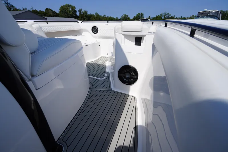 Slide: The Image of 2026 Tidewater 302 CC Adventure boat interior with cushioned seating and sleek flooring. - 28