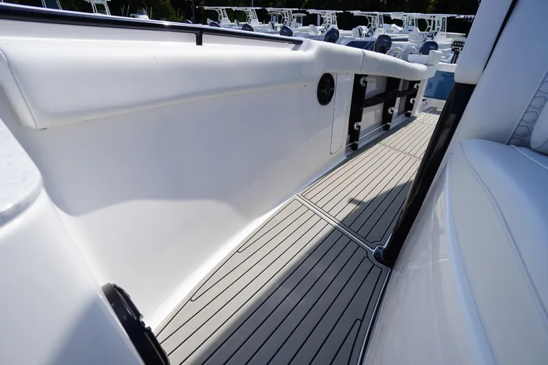 Slide: The Image of 2026 Tidewater 302 CC Adventure boat interior with sleek white design and modern features. - 29