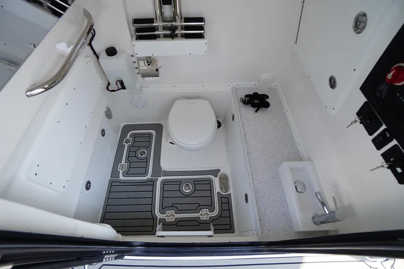 Slide: The Image of 2026 Tidewater 302 CC Adventure boat interior with toilet and sink. - 32