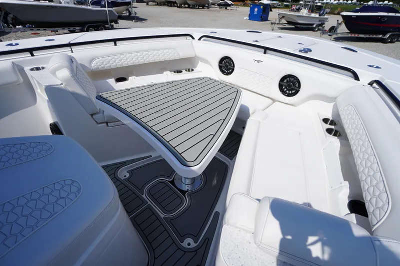 Slide: The Image of 2026 Tidewater 302 CC Adventure boat interior with stylish seating and modern design. - 4