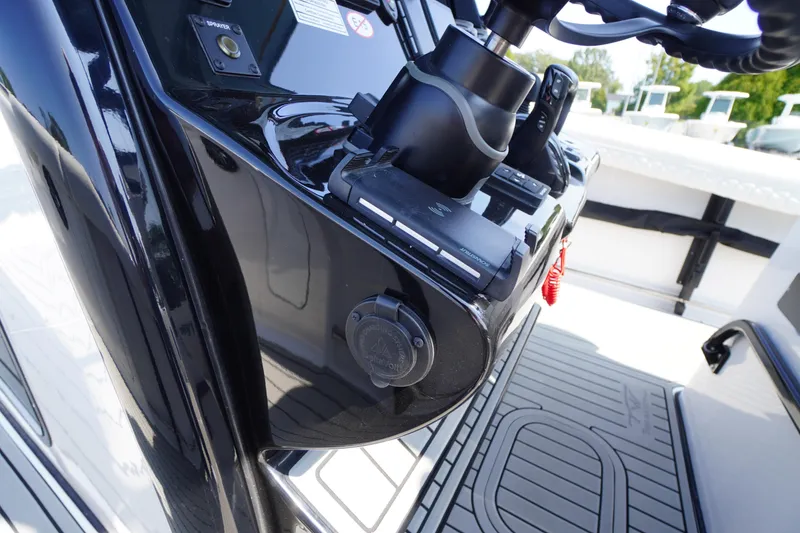 Slide: The Image of Close-up of 2026 Tidewater 302 CC Adventure boat's steering console and controls. - 46
