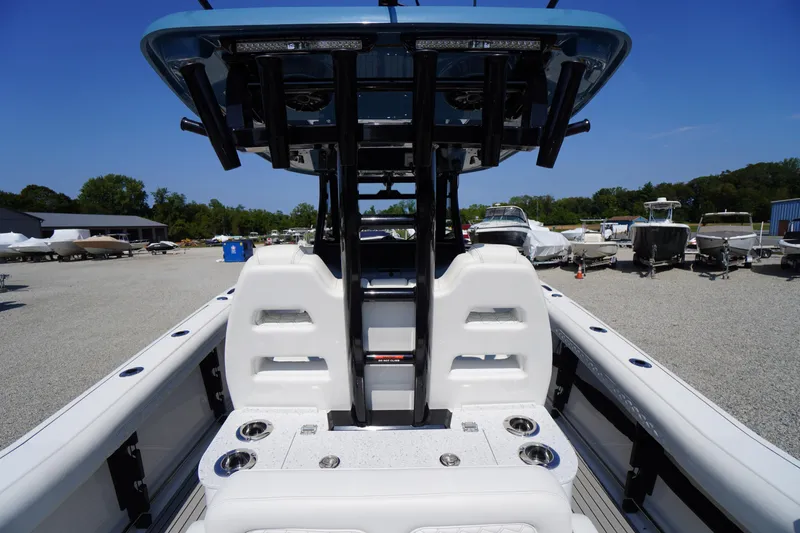 Slide: The Image of 2026 Tidewater 302 CC Adventure boat interior with seating and rod holders. - 53