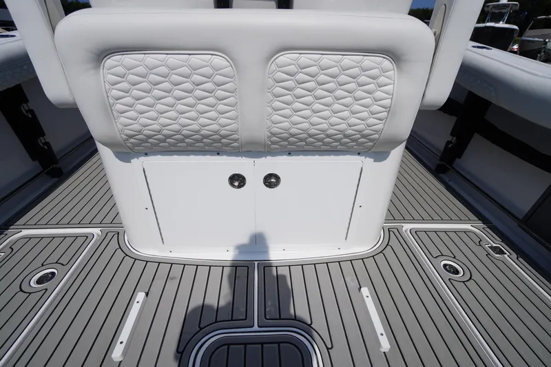 Slide: The Image of 2026 Tidewater 302 CC Adventure boat interior with quilted seating and sleek flooring design. - 55