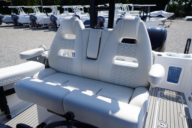 Slide: The Image of 2026 Tidewater 302 CC Adventure boat seating with modern design and white upholstery. - 57