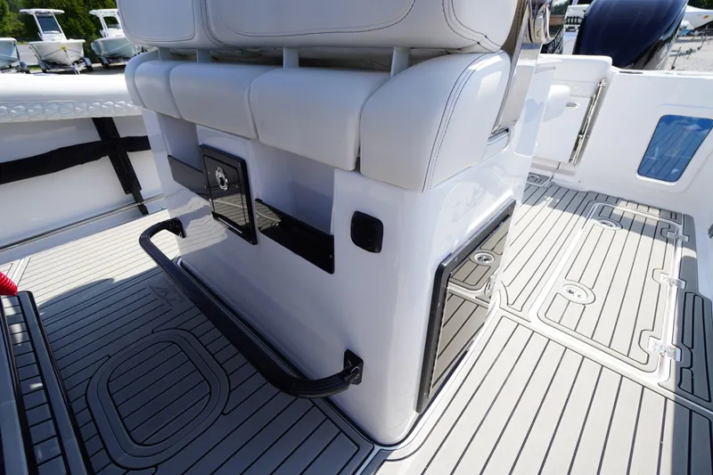 Slide: The Image of 2026 Tidewater 302 CC Adventure boat interior with sleek seating and modern deck design. - 58