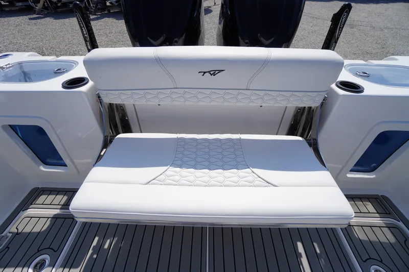 Slide: The Image of 2026 Tidewater 302 CC Adventure boat with luxurious white seating and modern design. - 64