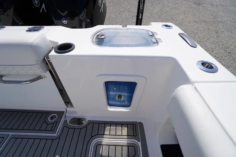 Slide: The Image of 2026 Tidewater 302 CC Adventure boat interior with seating and storage features. - 76