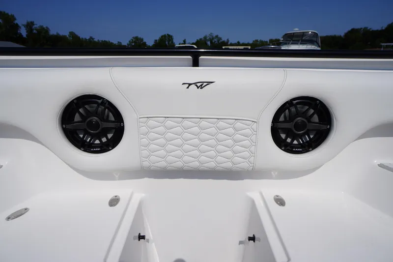 Slide: The Image of 2026 Tidewater 302 CC Adventure boat interior with speakers and quilted upholstery. - 8