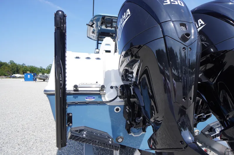 Slide: The Image of 2026 Tidewater 302 CC Adventure boat with dual Yamaha 350 engines, rear view. - 81