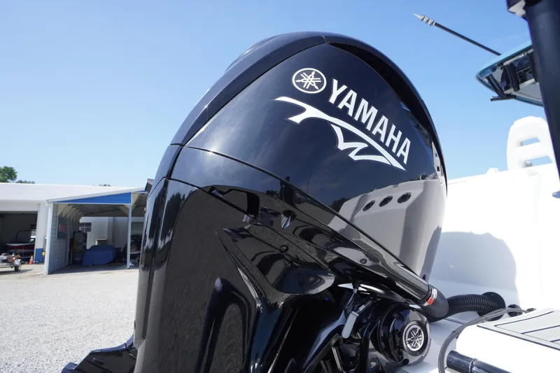 Slide: The Image of Yamaha outboard motor on 2026 Tidewater 302 CC Adventure boat, sunny day. - 84