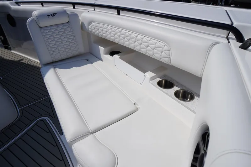 Slide: The Image of Luxurious seating on 2026 Tidewater 302 CC Adventure boat with cup holders. - 9