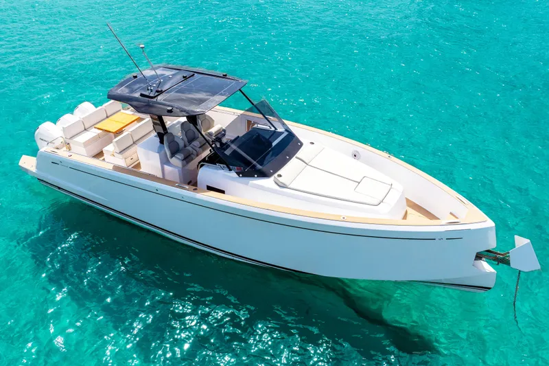 Slide: The Image of Triple Mercury outboard engines on 2025 Pardo Yachts P38 in turquoise water. - 14