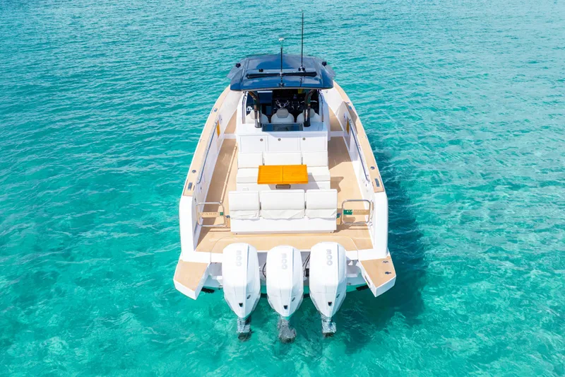 Slide: The Image of 2025 Pardo Yachts P38 on turquoise water, showcasing sleek design and luxury features. - 6