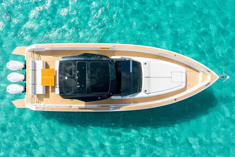 Slide: The Image of 2025 Pardo Yachts P38 in turquoise water, modern design, cityscape background. - 8