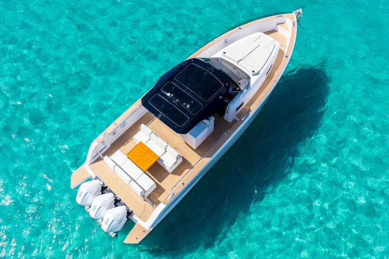 Slide: The Image of Aerial view of 2025 Pardo Yachts P38 on clear turquoise water. - 2