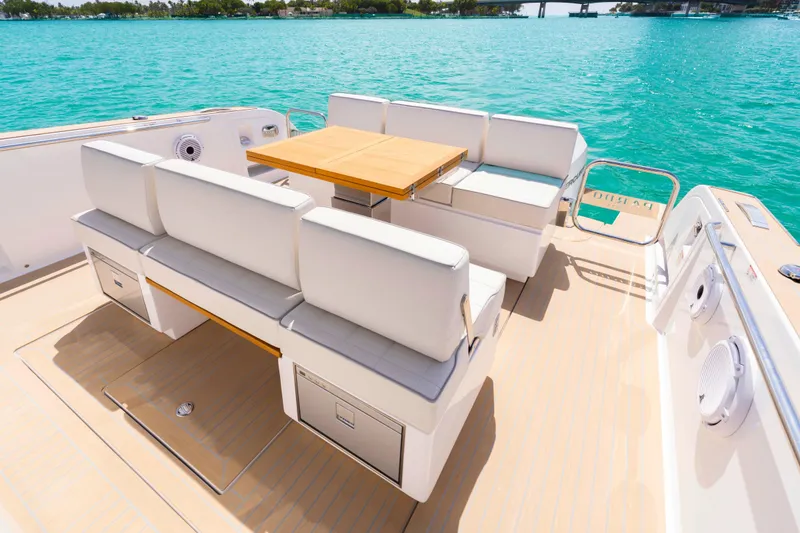 Slide: The Image of Luxury seating on the deck of a 2025 Pardo Yachts P38, under a bright sky. - 21