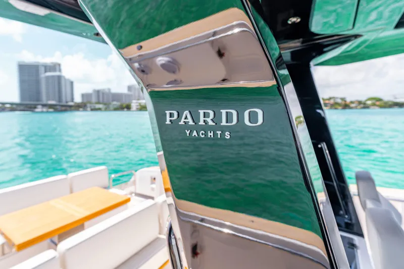 Slide: The Image of 2025 Pardo Yachts P38 helm with modern controls, steering wheel, and navigation screens. - 33