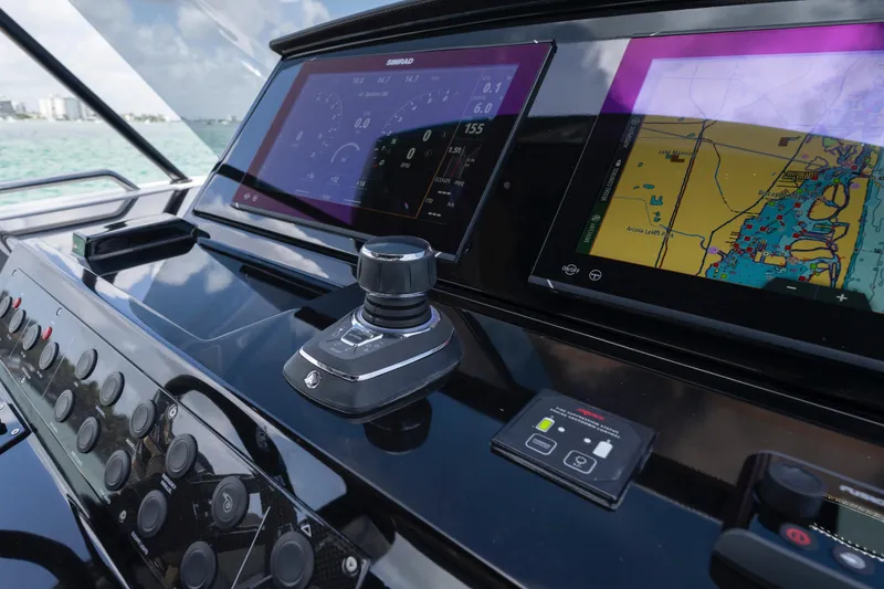 Slide: The Image of Interior view of 2025 Pardo Yachts P38, featuring sleek helm and luxurious seating. - 38