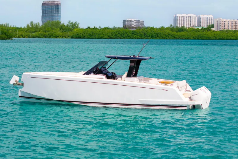 Slide: The Image of 2025 Pardo Yachts P38 with triple engines on turquoise water. - 9