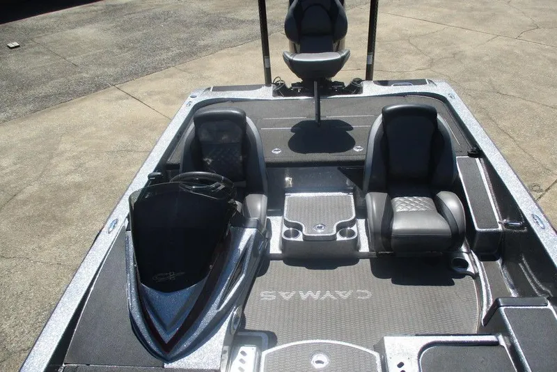 Slide: The Image of 2023 Caymas CX21 Pro boat interior with dual seats and steering console. - 5