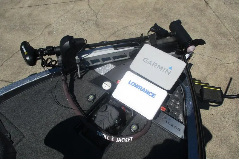 Slide: The Image of 2023 Caymas CX21 Pro boat with Garmin and Lowrance navigation systems on deck. - 7