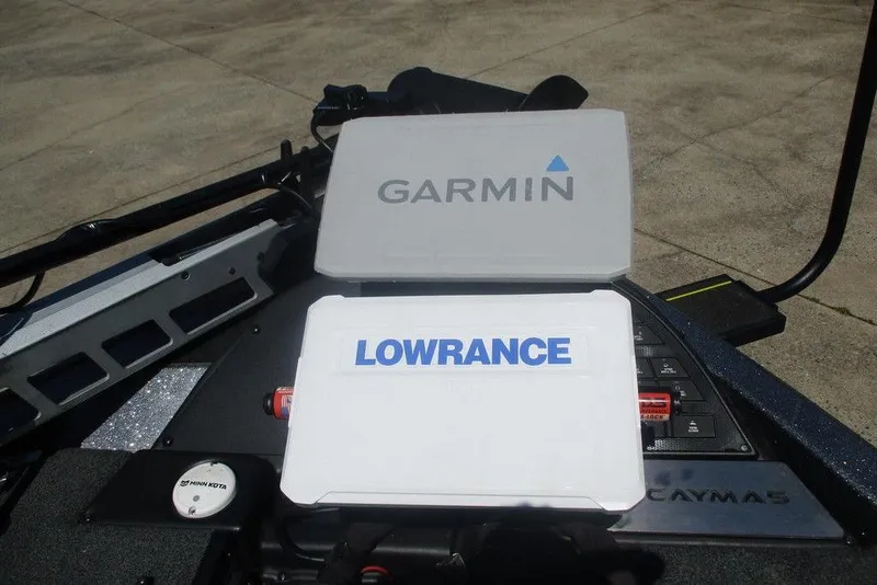 Slide: The Image of 2023 Caymas CX21 Pro boat dashboard with Garmin and Lowrance electronics. - 8