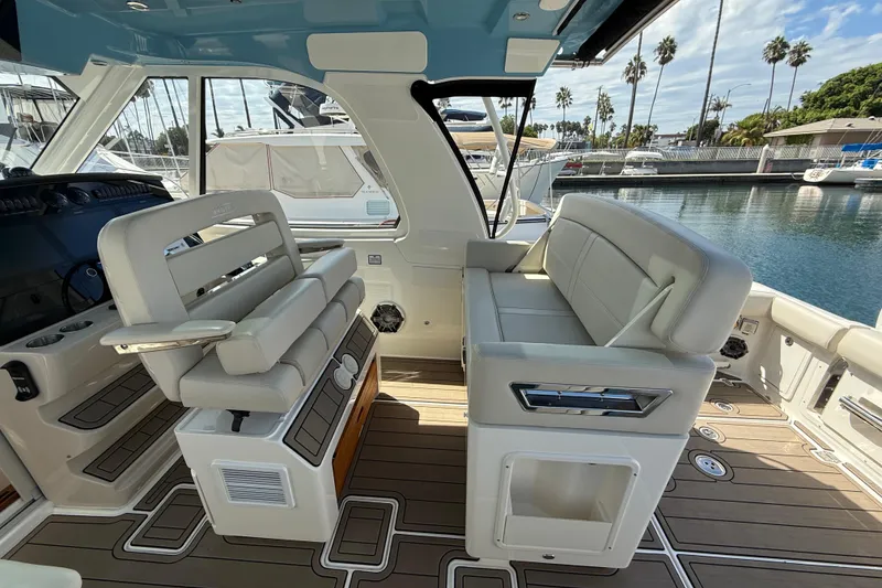 Slide: The Image of 2023 Boston Whaler 380 Realm interior with luxurious seating and modern design. - 13