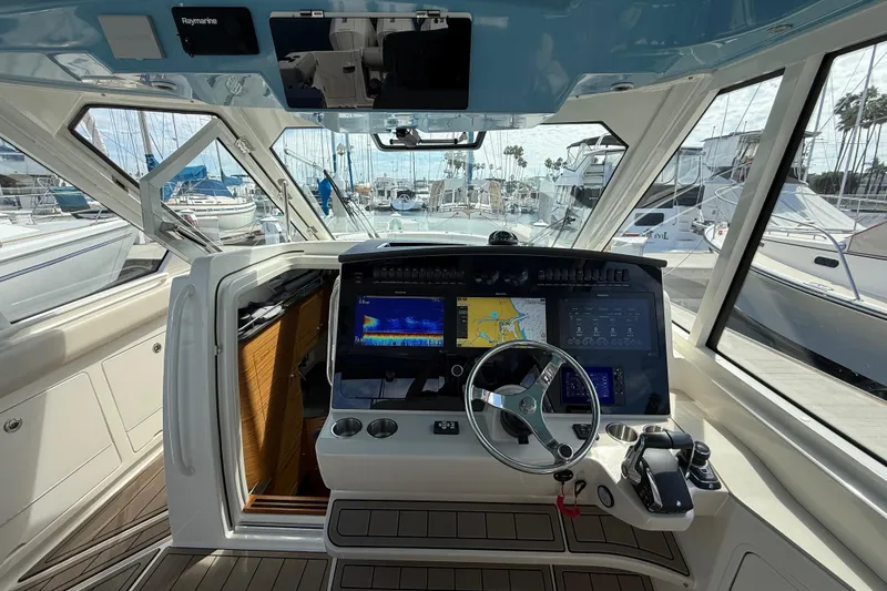 Slide: The Image of 2023 Boston Whaler 380 Realm helm with advanced navigation systems and luxurious interior. - 16