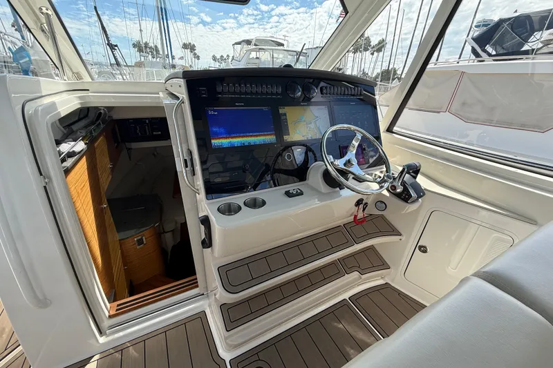 Slide: The Image of 2023 Boston Whaler 380 Realm helm with advanced navigation system and luxurious interior. - 17