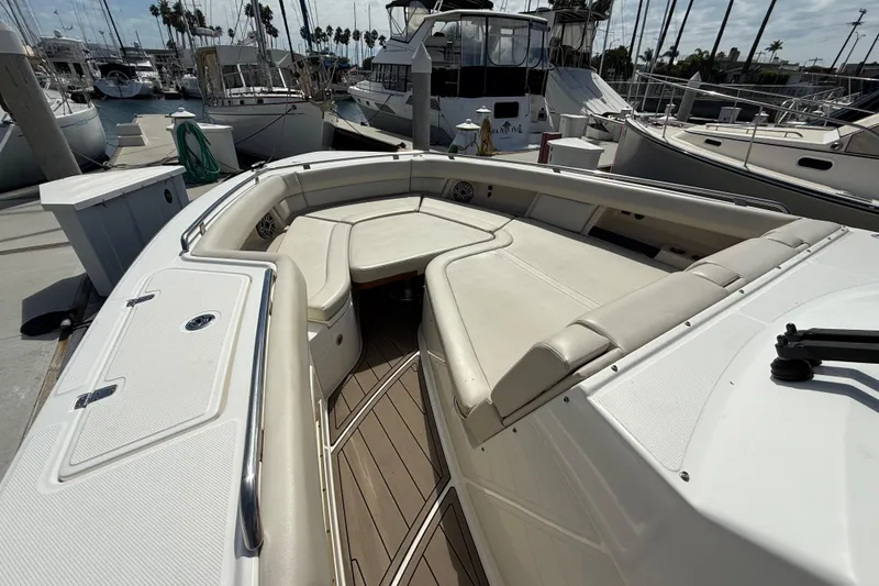 Slide: The Image of 2023 Boston Whaler 380 Realm boat with spacious seating at the dock. - 21
