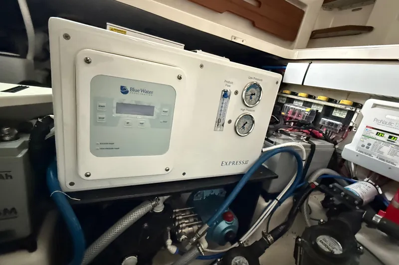 Slide: The Image of 2023 Boston Whaler 380 Realm engine room with Blue Water desalination system and ProNautic charger. - 32