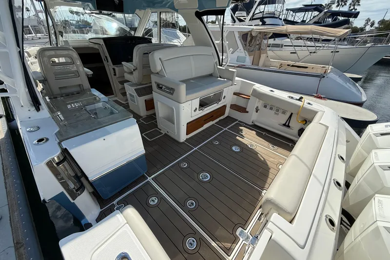 Slide: The Image of 2023 Boston Whaler 380 Realm interior with luxurious seating and modern design. - 7