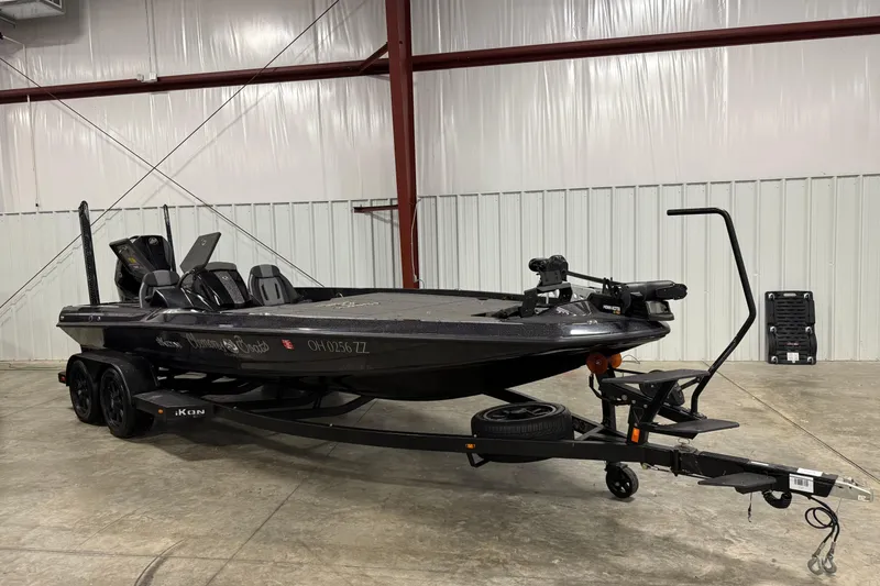 Slide: The Image of 2024 iKon LX21 boat on trailer in indoor storage facility. - 0