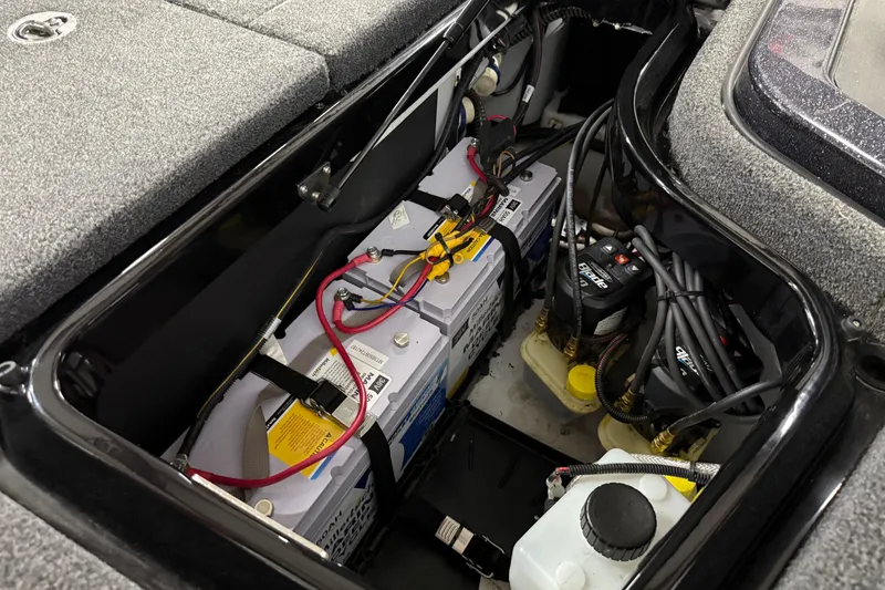 Slide: The Image of Battery compartment of 2024 iKon LX21 boat, featuring wiring and components. - 7