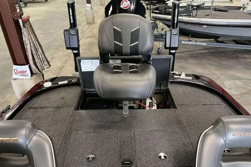 Slide: The Image of 2019 Nitro Z20 Pro boat interior with black seating and fishing equipment. - 4