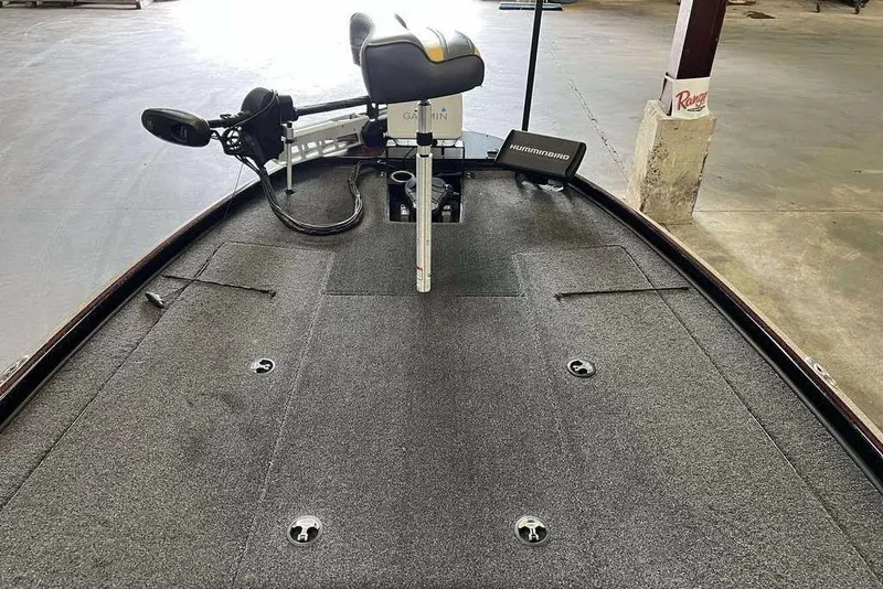 Slide: The Image of Nitro Z20 Pro 2019 boat deck with fishing equipment and electronics in a garage setting. - 5