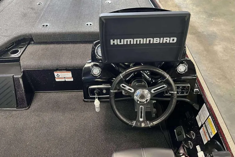 Slide: The Image of 2019 Nitro Z20 Pro boat dashboard with Humminbird display and steering wheel. - 6