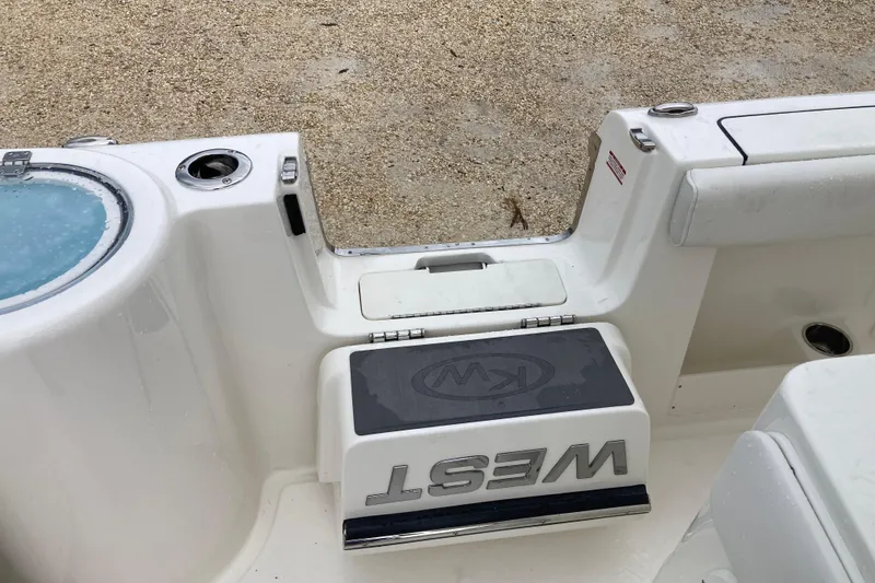 Slide: The Image of 2026 Key West 260 Center Console boat interior with storage compartment and seating. - 15