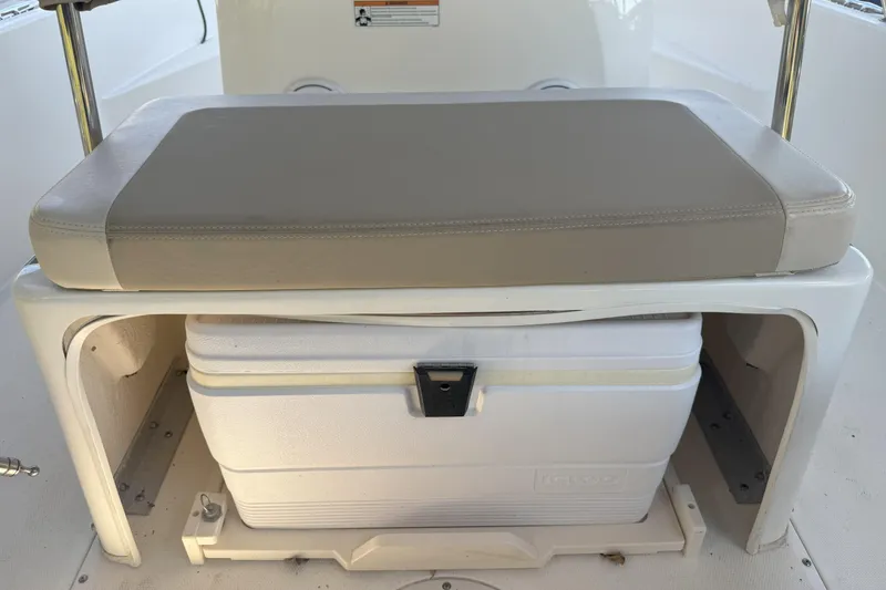 Slide: The Image of 2017 Boston Whaler 180 Dauntless boat seat with integrated cooler storage. - 7