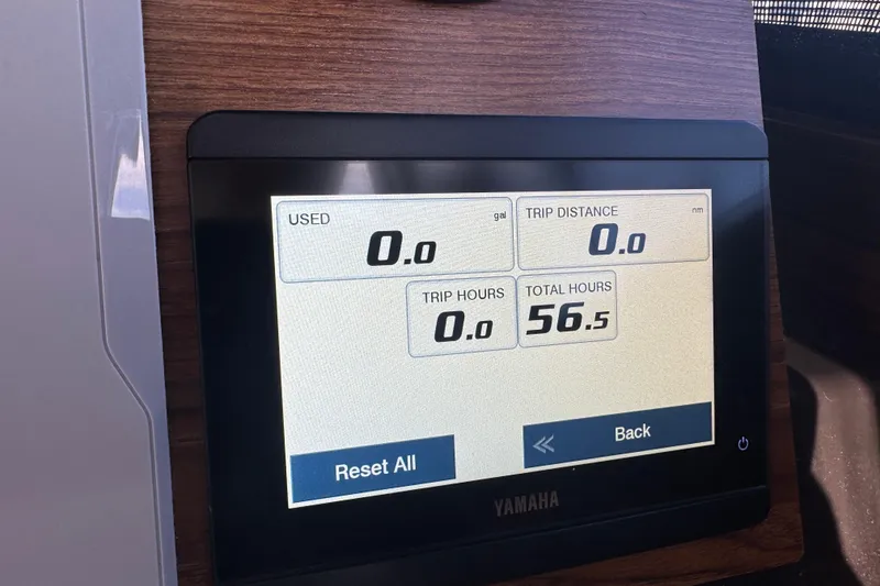 Slide: The Image of Yamaha display on 2025 Ranger Tugs R-27 showing trip and total hours. - 13