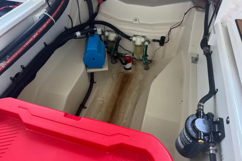 Slide: The Image of Interior view of 2025 Ranger Tugs R-27 boat showing engine compartment details. - 26